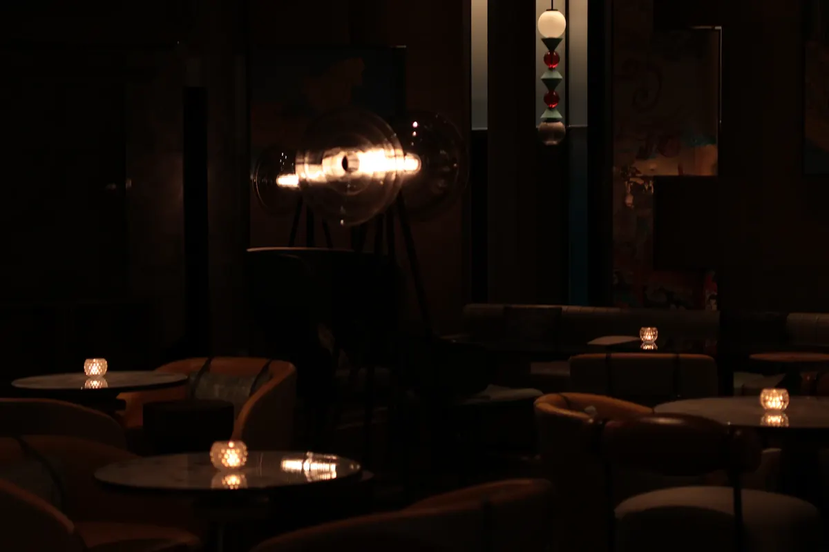 Warm candlelit Nashville cocktail lounge at night